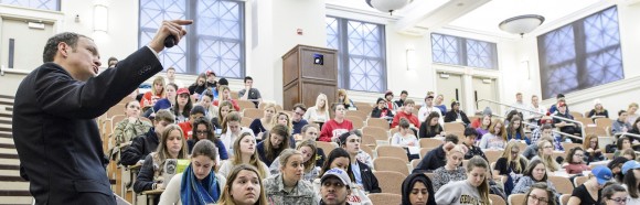 A professor lectures a classroom.