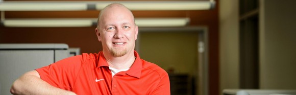 Brian Zimmerman, application development and integration programmer in the Human Resource System Infrastructure Group at the Department of Information Technology, works at his computer station at the 21 North Park Street Building at the University of Wisconsin-Madison on March 15, 2018. Zimmerman is one of eight recipients of a 2018 University Staff Recognition Award (USRA).