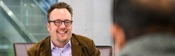 Michael Wagner, associate professor of journalism and mass communication, talks with a small group of faculty and students about the team's academic research project during a meeting at the library in Grainger Hall at the University of Wisconsin-Madison on Feb. 22, 2019. Wagner, who is currently on sabbatical, is one of ten 2019 Distinguished Teaching Award recipients.